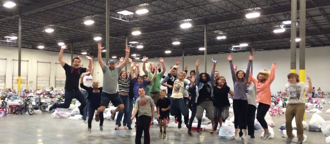 A group of people jumping in a group photo