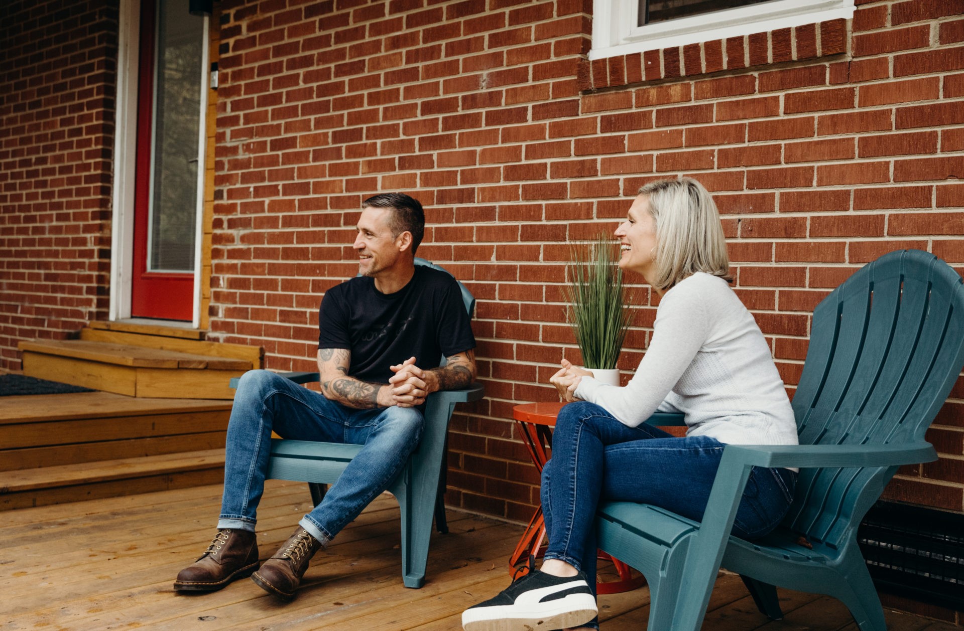 Two people sitting outside